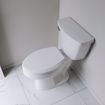 Picture of White Premium Plastic Toilet Seat, Closed Front with Cover, Slow-Close and QuicKlean® Hinges, Elongated